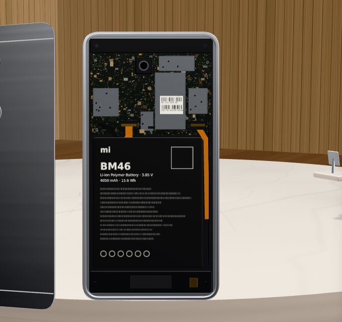 The Redmi Note 3 opened from the back: board at the top, the BM46 battery below.
